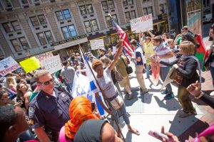 Chloé Simone Valdary surrounded by anti-Israel protesters in Boston.