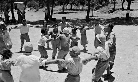 Jewish residents dancing the hora in celebration of the declaration of the State of Israel. Photograph by Frank Noel.