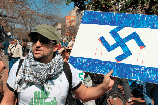 An anti-Israel protester equates Israel with Nazi Germany.