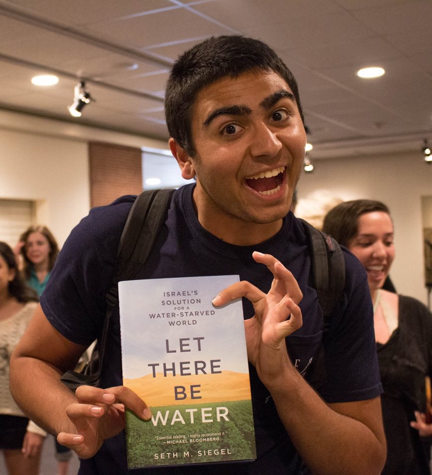Poly Tech student at CAMERA-supported event holding Seth Siegel's book, Let There Be Water. Source: Mustangs United for Israel Facebook page